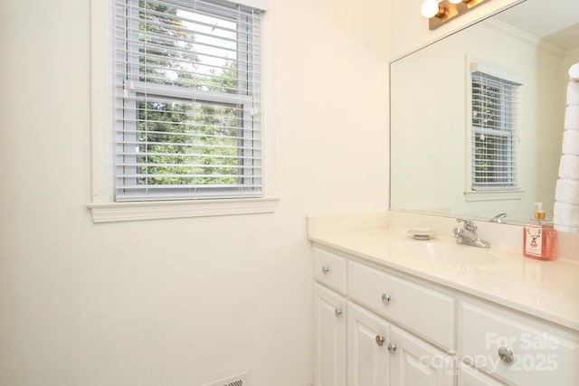 bathroom featuring vanity and crown molding