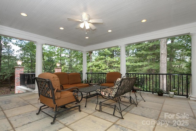 sunroom with a ceiling fan