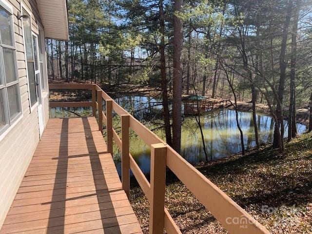 wooden terrace with a water view