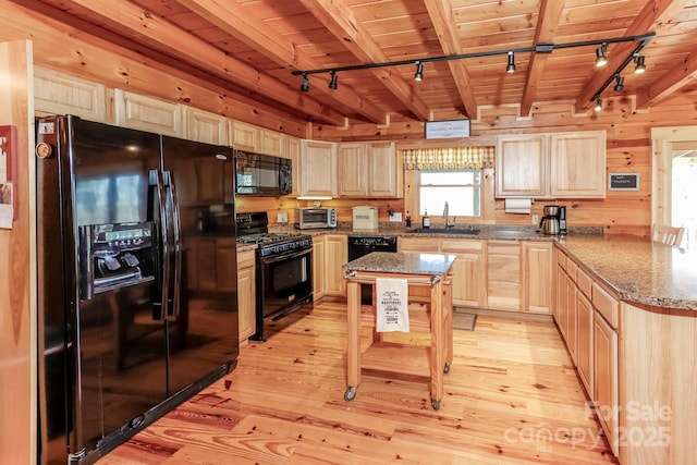 kitchen featuring wood ceiling, light brown cabinetry, light wood-type flooring, black appliances, and a sink