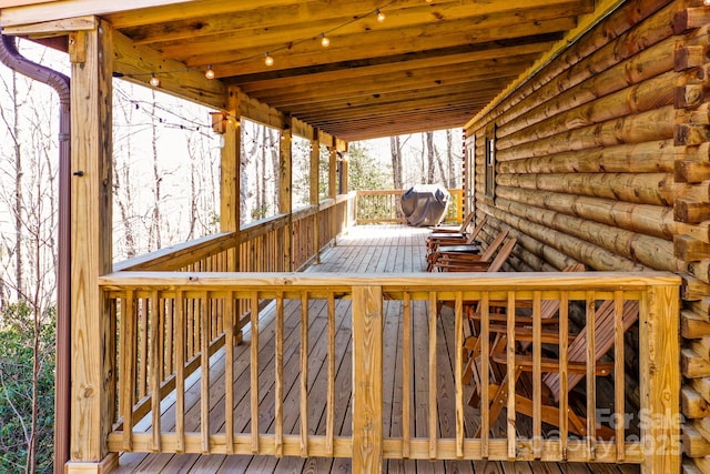 wooden terrace with grilling area