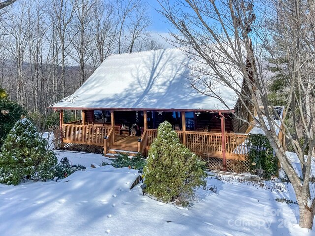 log cabin with a deck