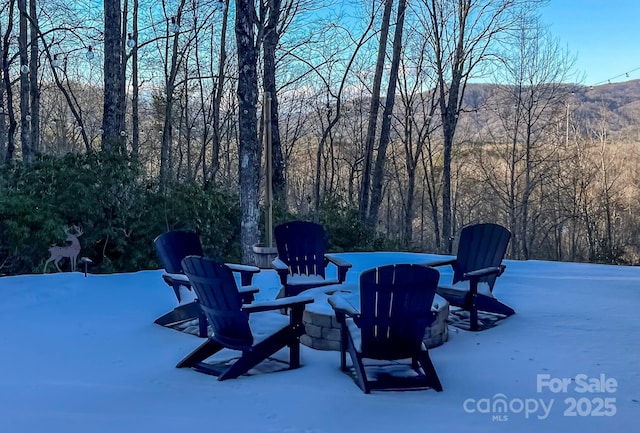 view of patio featuring a wooded view