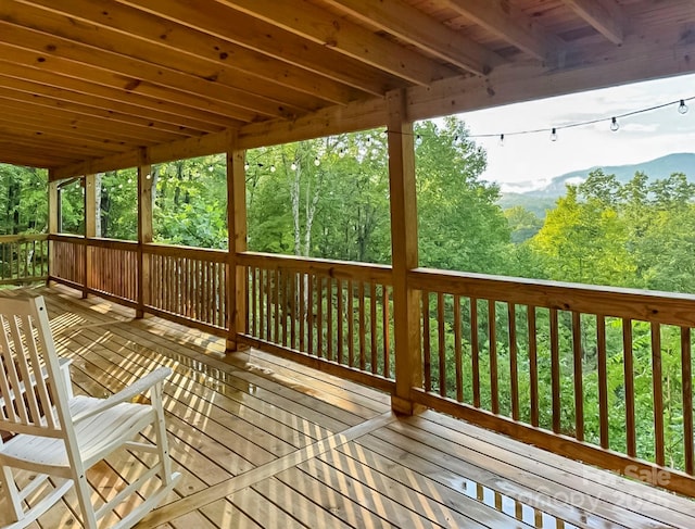deck featuring a forest view