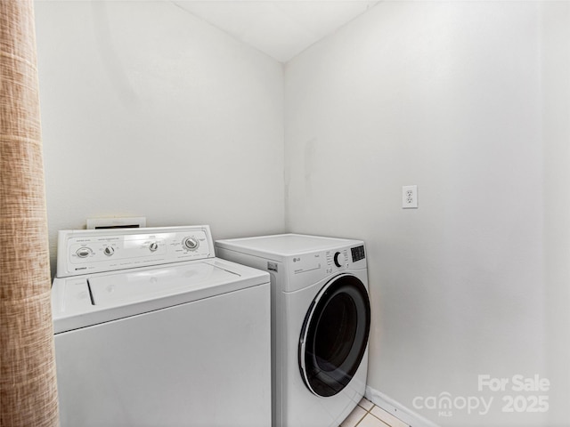 laundry area with laundry area and washer and dryer