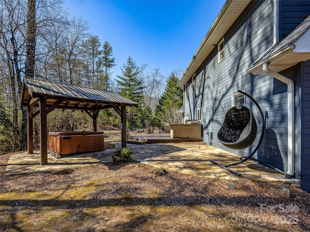 view of yard featuring a patio and a hot tub