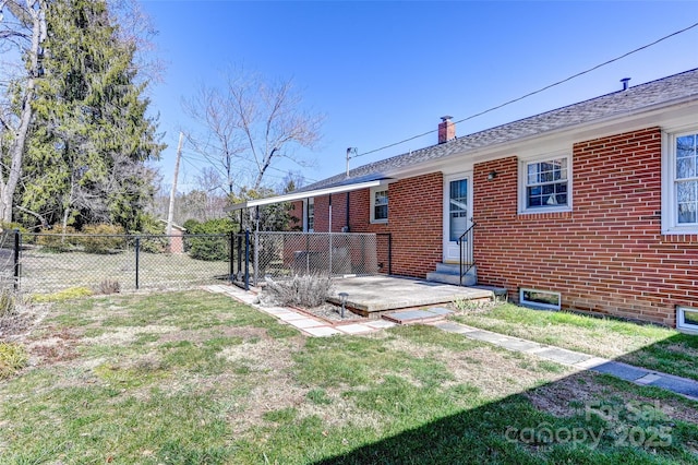 view of yard featuring entry steps and fence