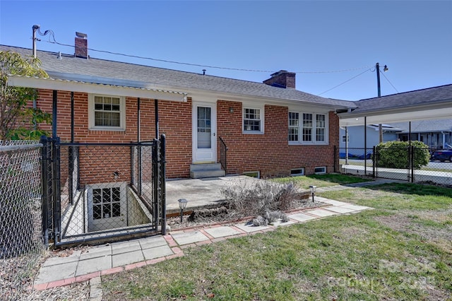 view of front of property featuring entry steps, brick siding, fence, and a chimney