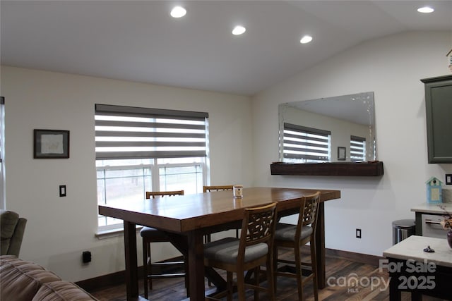 dining area with baseboards, vaulted ceiling, dark wood-style flooring, and recessed lighting