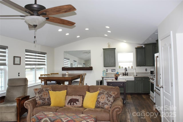 living area with dark wood-style floors, recessed lighting, vaulted ceiling, and a ceiling fan