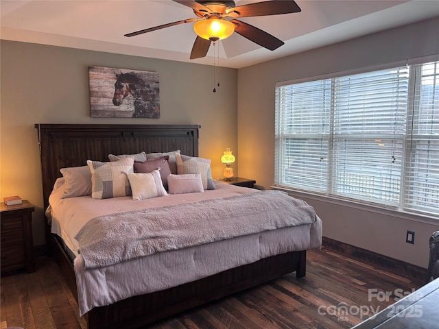 bedroom with a ceiling fan and wood finished floors