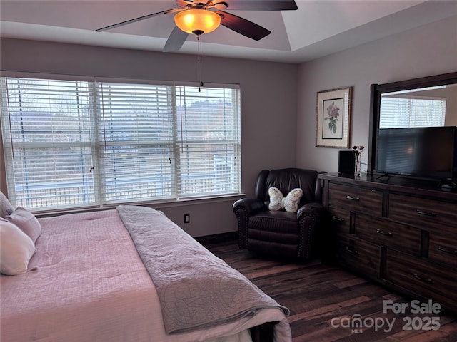 bedroom featuring dark wood finished floors and a ceiling fan