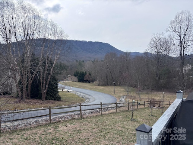 property view of mountains featuring a forest view