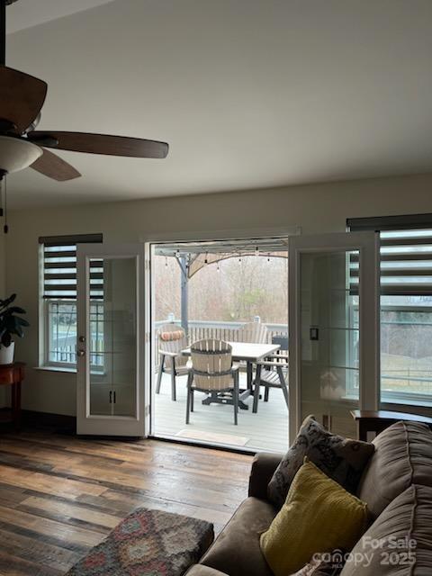 living area featuring a ceiling fan and wood-type flooring