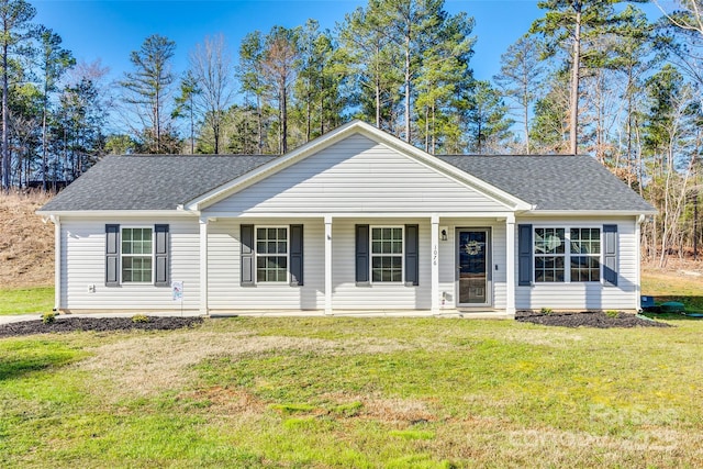 ranch-style home featuring a shingled roof, a porch, and a front yard