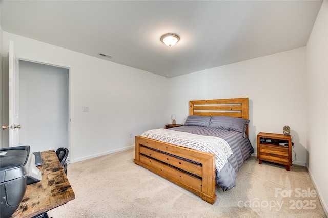 bedroom with carpet, visible vents, and baseboards