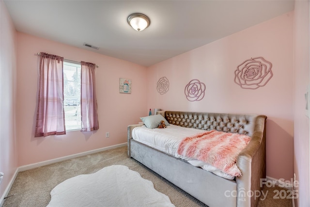 carpeted bedroom with baseboards and visible vents