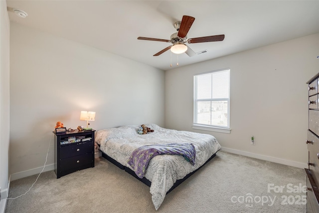 bedroom with ceiling fan, visible vents, baseboards, and light colored carpet