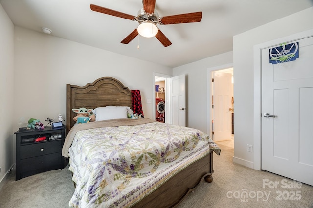 bedroom featuring light carpet and ceiling fan