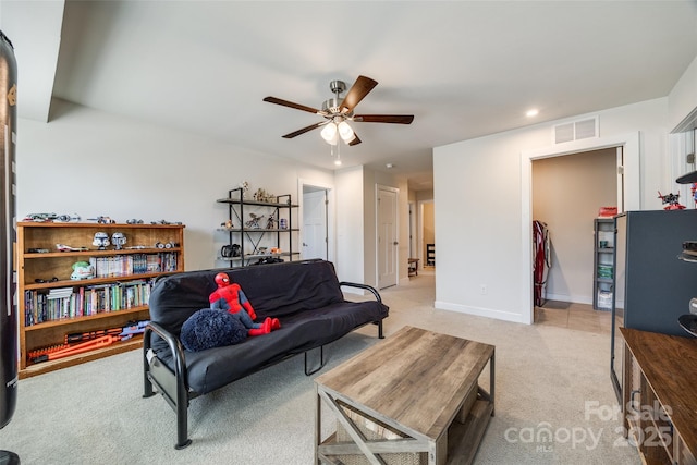 living room featuring recessed lighting, light colored carpet, visible vents, ceiling fan, and baseboards