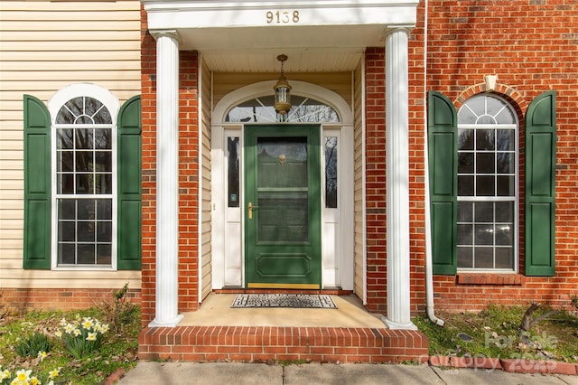 entrance to property with brick siding