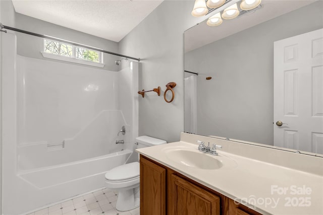 full bathroom featuring a textured ceiling, toilet, bathing tub / shower combination, vanity, and tile patterned floors