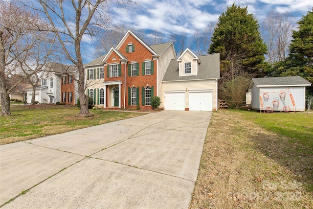 view of front facade featuring brick siding, an attached garage, a storage shed, a front yard, and driveway