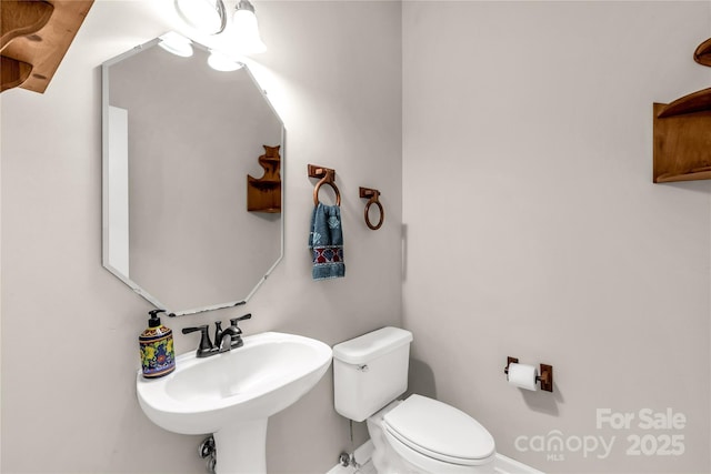 9138 Babbitt Way, Charlotte, NC 28216 - half bathroom featuring toilet and a sink