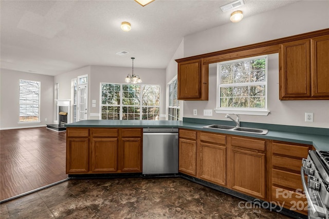 9138 Babbitt Way, Charlotte, NC 28216 - kitchen featuring stainless steel appliances, brown cabinets, and plenty of natural light