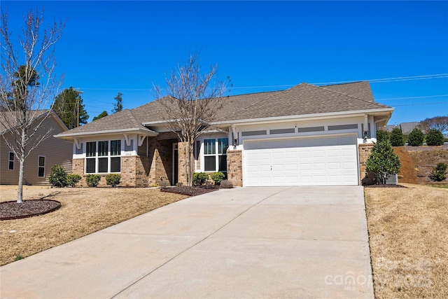 view of front facade with concrete driveway, an attached garage, brick siding, and a shingled roof