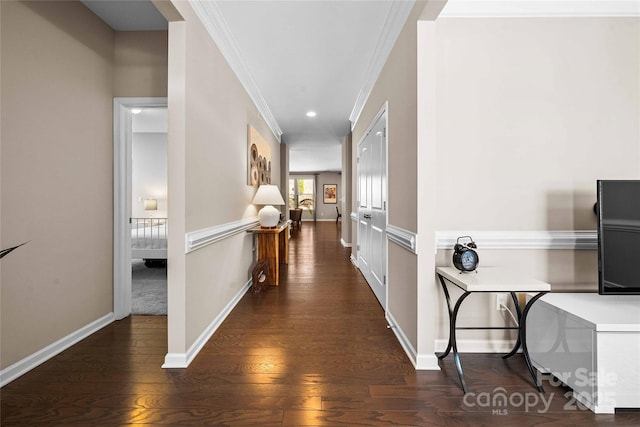 corridor with crown molding, recessed lighting, wood finished floors, and baseboards