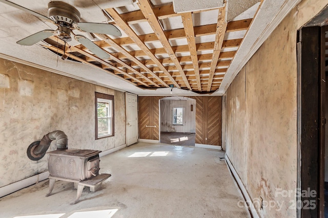 interior space with ceiling fan