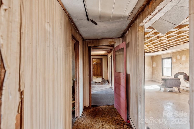 hall featuring wooden walls