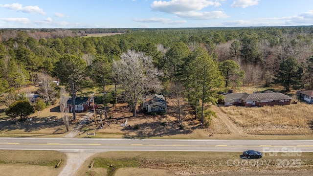 aerial view featuring a view of trees