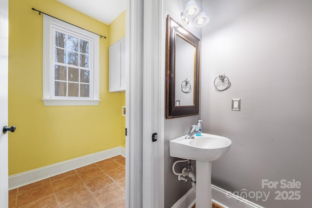 bathroom featuring baseboards and tile patterned floors