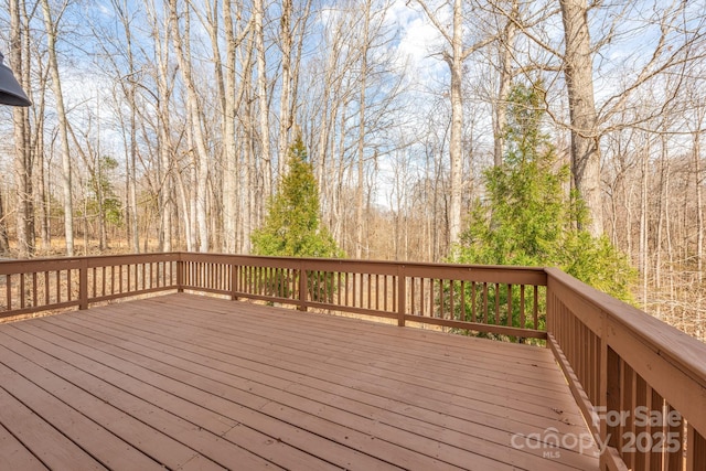 wooden terrace with a forest view