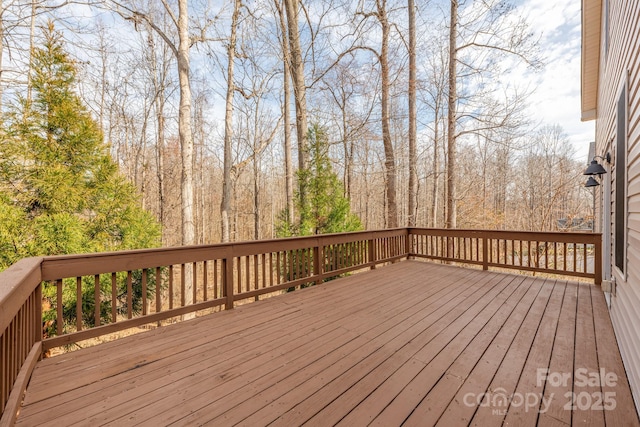 wooden terrace with a forest view