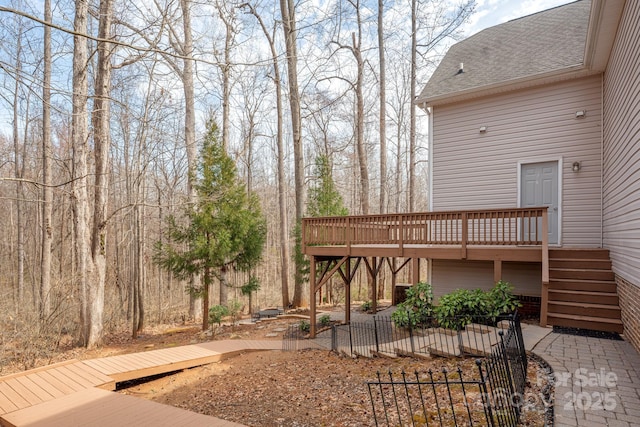 wooden deck featuring a patio area