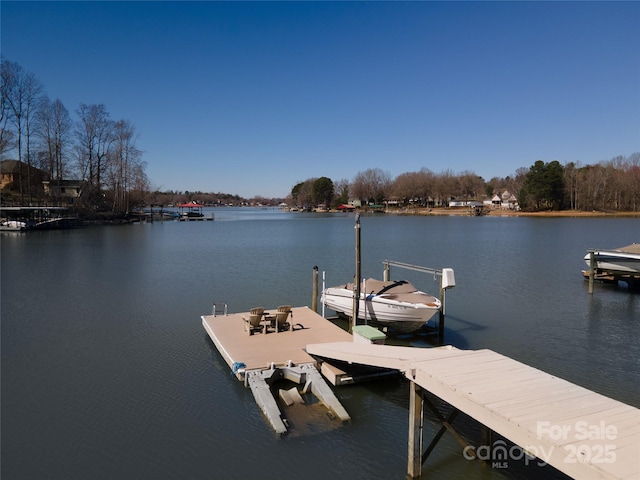 view of dock with a water view and boat lift