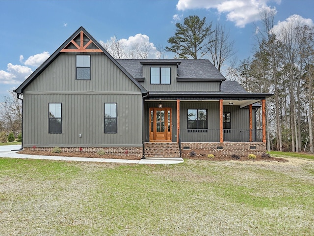 view of front facade featuring a porch, crawl space, roof with shingles, and a front lawn