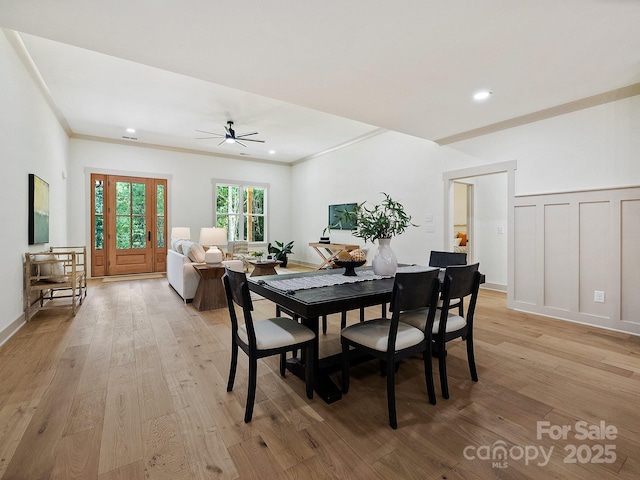 dining room with recessed lighting, a decorative wall, a ceiling fan, light wood-type flooring, and crown molding