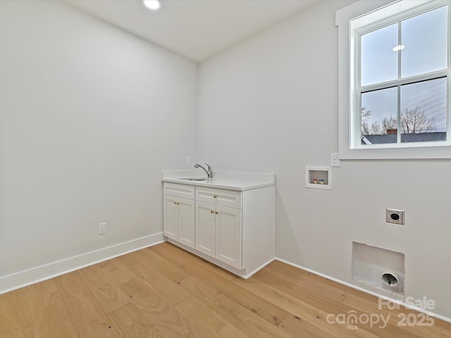 laundry room with washer hookup, light wood-style flooring, a sink, electric dryer hookup, and baseboards