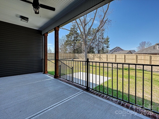 balcony with a patio area and a ceiling fan