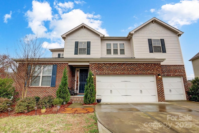 traditional home with brick siding, driveway, and a garage