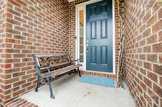 entrance to property with brick siding