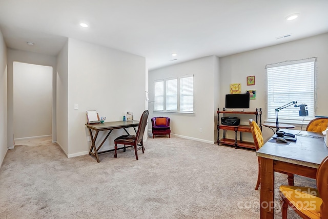 carpeted office space featuring recessed lighting, visible vents, and baseboards