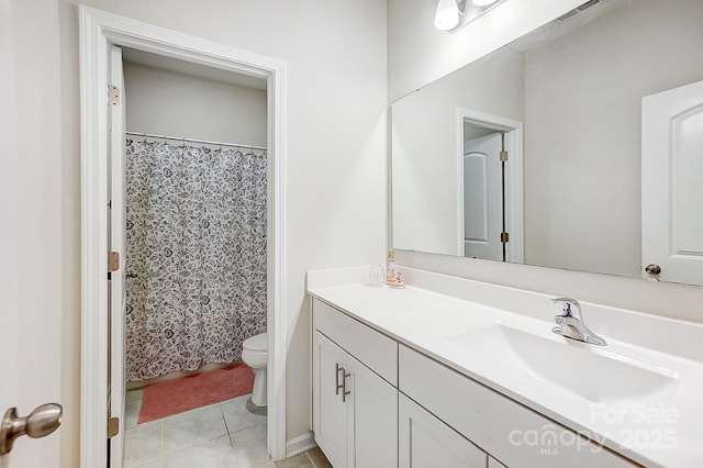 bathroom with vanity, tile patterned floors, toilet, and visible vents