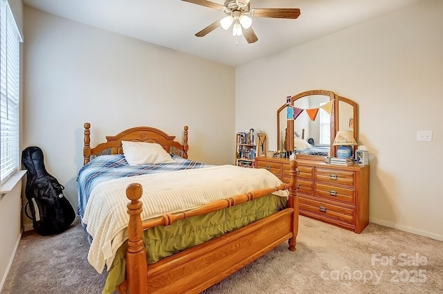 bedroom with baseboards, light carpet, and ceiling fan