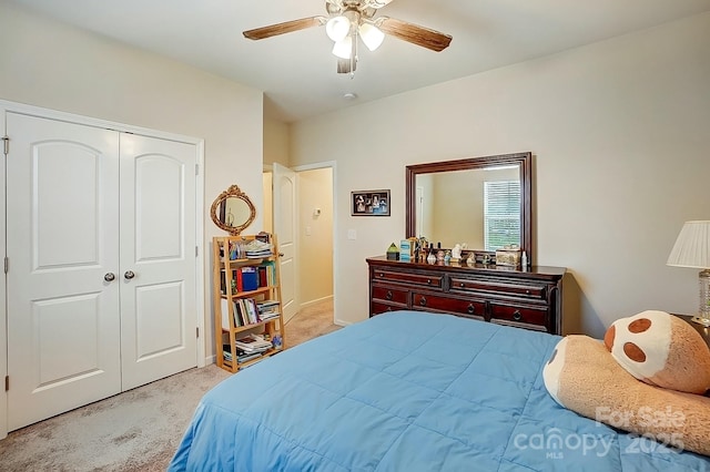 bedroom with carpet, a closet, and ceiling fan