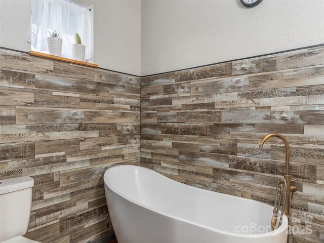 full bath with a soaking tub and wooden walls